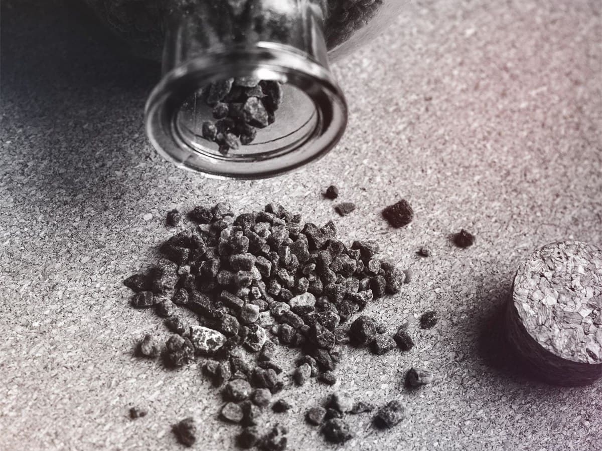 Industrial polymer granules poured out for inspection