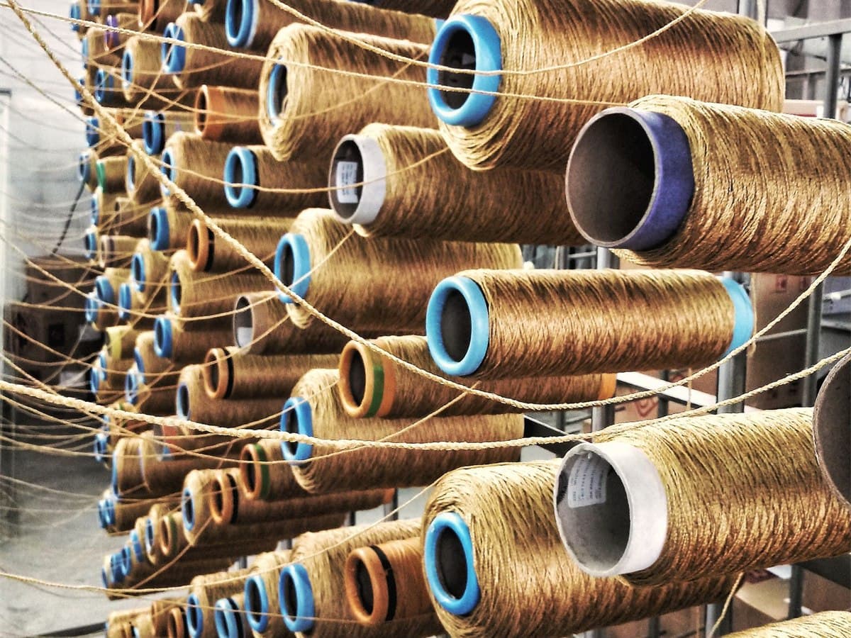 Cones of spun cotton yarn racked in a textile mill